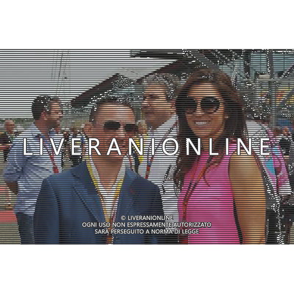 (L to R): Frankie Dettori (ITA) Jockey with Fabiana Flosi (BRA) on the grid. 05.07.2015. Formula 1 World Championship, Rd 9, British Grand Prix, Silverstone, England, Race Day. AG ALDO LIVERANI SAS ONLY ITALY
