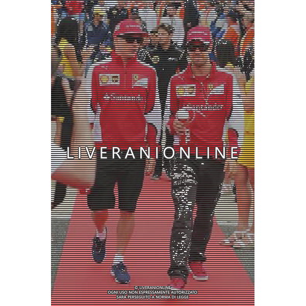 (L to R): Kimi Raikkonen (FIN) Ferrari with team mate Sebastian Vettel (GER) Ferrari on the drivers parade. 05.07.2015. Formula 1 World Championship, Rd 9, British Grand Prix, Silverstone, England, Race Day. AG ALDO LIVERANI SAS ONLY ITALY