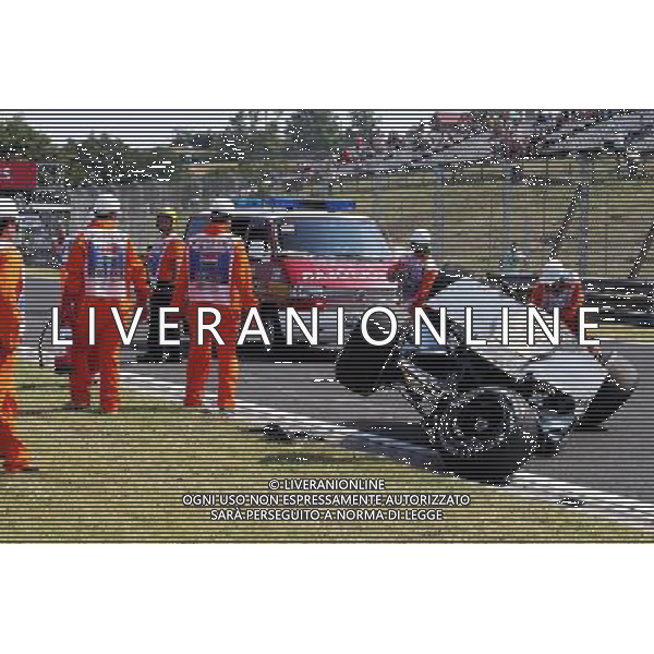 Marshals recover the Sahara Force India F1 VJM08 of Sergio Perez (MEX) after he crashed in the first practice session. 24.07.2015. Formula 1 World Championship, Rd 10, Hungarian Grand Prix, Budapest, Hungary, Practice Day. ONLY ITALY-AG ALDOL IVERANI SAS