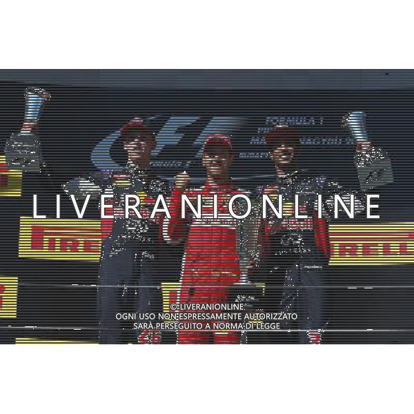 1st place Sebastian Vettel (GER) Ferrari, 2nd place Daniil Kvyat (RUS) Red Bull Racing RB11, and 3rd place Daniel Ricciardo (AUS) Red Bull Racing. 26.07.2015. Formula 1 World Championship, Rd 10, Hungarian Grand Prix, Budapest, Hungary, Race Day. /AGENZIA ALDO LIVERANI Sas - ITALY ONLY - EDITORIAL USE ONLY