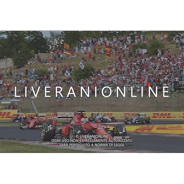 Sebastian Vettel (GER) Ferrari SF15-T leads at the start of the race. 26.07.2015. Formula 1 World Championship, Rd 10, Hungarian Grand Prix, Budapest, Hungary, Race Day. AG ALDO LIVERANI SAS ONLY ITALY