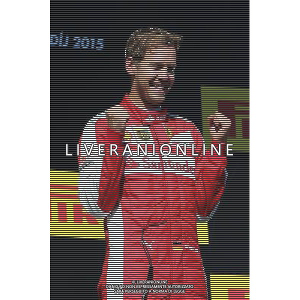Race winner Sebastian Vettel (GER) Ferrari celebrates on the podium. 26.07.2015. Formula 1 World Championship, Rd 10, Hungarian Grand Prix, Budapest, Hungary, Race Day. AG ALDO LIVERANI SAS ONLY ITALY