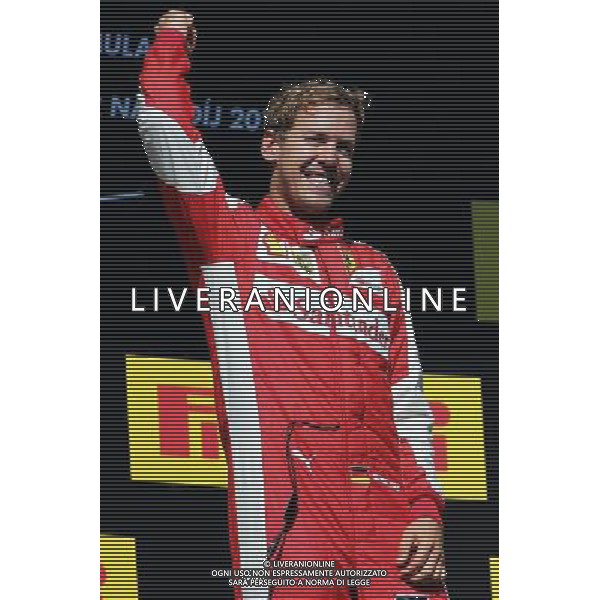 Race winner Sebastian Vettel (GER) Ferrari celebrates on the podium. 26.07.2015. Formula 1 World Championship, Rd 10, Hungarian Grand Prix, Budapest, Hungary, Race Day. AG ALDO LIVERANI SAS ONLY ITALY