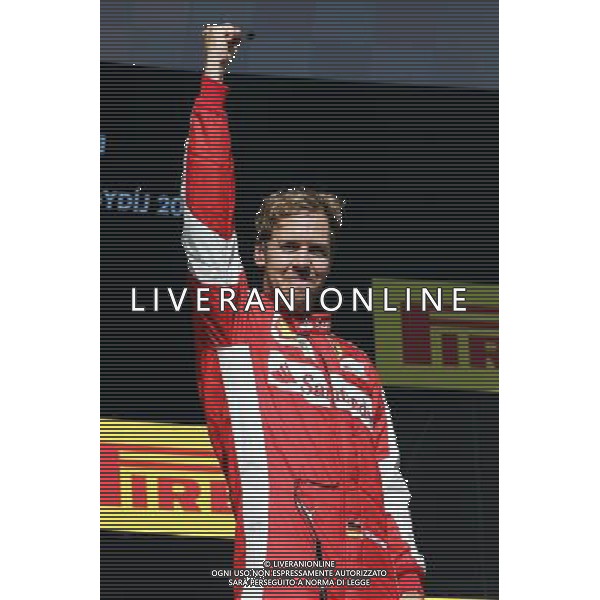 Race winner Sebastian Vettel (GER) Ferrari celebrates on the podium. 26.07.2015. Formula 1 World Championship, Rd 10, Hungarian Grand Prix, Budapest, Hungary, Race Day. AG ALDO LIVERANI SAS ONLY ITALY