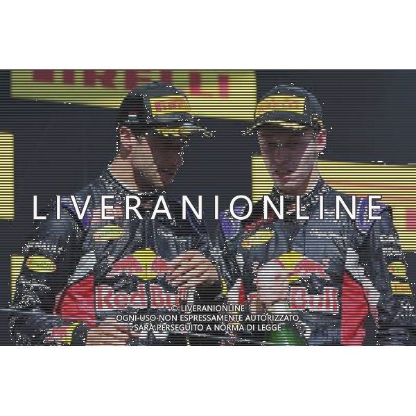 (L to R): third placed Daniel Ricciardo (AUS) Red Bull Racing with second placed team mate Daniil Kvyat (RUS) Red Bull Racing on the podium. 26.07.2015. Formula 1 World Championship, Rd 10, Hungarian Grand Prix, Budapest, Hungary, Race Day. AG ALDO LIVERANI SAS ONLY ITALY