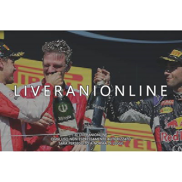 (L to R): Race winner Sebastian Vettel (GER) Ferrari and James Allison (GBR) Ferrari Chassis Technical Director celebrate on the podium with Daniel Ricciardo (AUS) Red Bull Racing. 26.07.2015. Formula 1 World Championship, Rd 10, Hungarian Grand Prix, Budapest, Hungary, Race Day. AG ALDO LIVERANI SAS ONLY ITALY