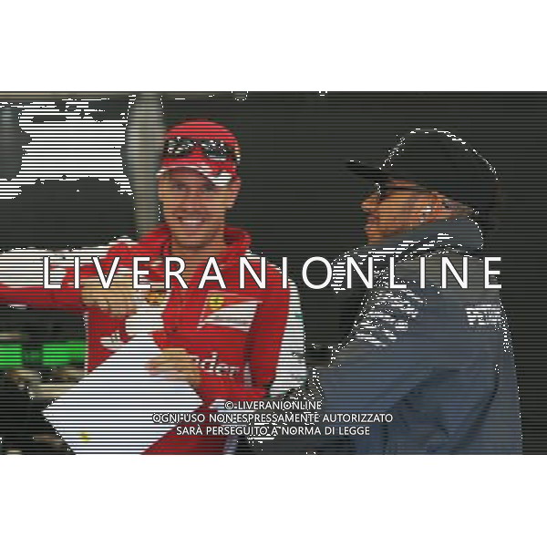 (L to R): Sebastian Vettel (GER) Ferrari with Lewis Hamilton (GBR) Mercedes AMG F1. 23.08.2015. Formula 1 World Championship, Rd 13, Belgian Grand Prix, Spa Francorchamps, Belgium, Race Day. /AGENZIA ALDO LIVERANI SAS - ITALY ONLY - EDITORIAL USE ONLY - Gp F1 Belgio Gara
