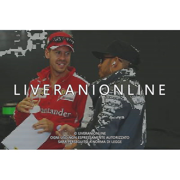 (L to R): Sebastian Vettel (GER) Ferrari with Lewis Hamilton (GBR) Mercedes AMG F1. 23.08.2015. Formula 1 World Championship, Rd 13, Belgian Grand Prix, Spa Francorchamps, Belgium, Race Day. /AGENZIA ALDO LIVERANI SAS - ITALY ONLY - EDITORIAL USE ONLY - Gp F1 Belgio Gara