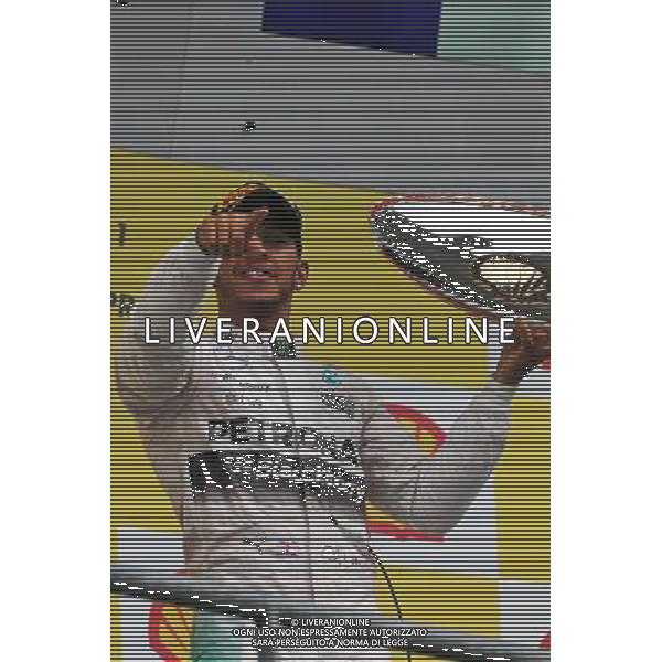 Race winner Lewis Hamilton (GBR) Mercedes AMG F1 celebrates on the podium. 23.08.2015. Formula 1 World Championship, Rd 13, Belgian Grand Prix, Spa Francorchamps, Belgium, Race Day. /AGENZIA ALDO LIVERANI SAS - ITALY ONLY - EDITORIAL USE ONLY - Gp F1 Belgio Gara