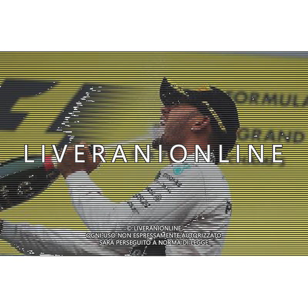 Race winner Lewis Hamilton (GBR) Mercedes AMG F1 celebrates on the podium. 23.08.2015. Formula 1 World Championship, Rd 13, Belgian Grand Prix, Spa Francorchamps, Belgium, Race Day. /AGENZIA ALDO LIVERANI SAS - ITALY ONLY - EDITORIAL USE ONLY - Gp F1 Belgio Gara
