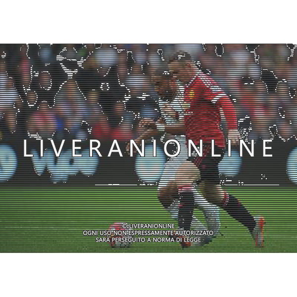 Manchester United\'s Wayne Rooney is tackled by Swansea City\'s Ashley Williams, leading to claims for a penalty Photographer Kevin Barnes/CameraSport Football - Barclays Premiership - Swansea City v Manchester United - Sunday 30th August 2015 - Liberty Stadium - Swansea © CameraSport - 43 Linden Ave. Countesthorpe. Leicester. England. LE8 5PG - Tel: +44 (0) 116 277 4147 - admin@camerasport.com - www.camerasport.com AG ALDO LIVERANI SAS ONLY ITALY