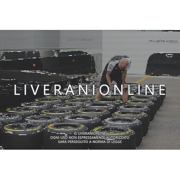 McLaren mechanic with Pirelli tyres. 03.09.2015. Formula 1 World Championship, Rd 12, Italian Grand Prix, Monza, Italy, Preparation Day. AG ALDO LIVERANI SAS ONLY ITALY