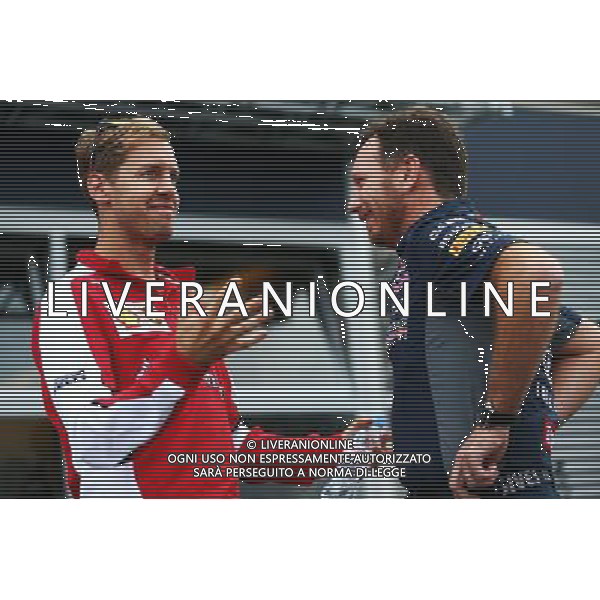 (L to R): Sebastian Vettel (GER) Ferrari with Christian Horner (GBR) Red Bull Racing Team Principal. 04.09.2015. Formula 1 World Championship, Rd 12, Italian Grand Prix, Monza, Italy, Practice Day. AG ALDO LIVERANI SAS ONLY ITALY