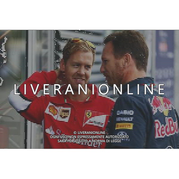 (L to R): Sebastian Vettel (GER) Ferrari with Christian Horner (GBR) Red Bull Racing Team Principal. 04.09.2015. Formula 1 World Championship, Rd 12, Italian Grand Prix, Monza, Italy, Practice Day. AG ALDO LIVERANI SAS ONLY ITALY