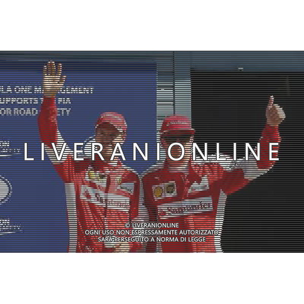 (L to R): Third placed Sebastian Vettel (GER) Ferrari and second placed team mate Kimi Raikkonen (FIN) Ferrari celebrate in parc ferme. 05.09.2015. Formula 1 World Championship, Rd 12, Italian Grand Prix, Monza, Italy, Qualifying Day. AG ALDO LIVERANI SAS ONLY ITALY
