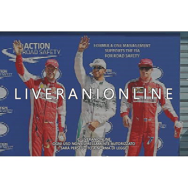 Qualifying top three in parc ferme (L to R): Sebastian Vettel (GER) Ferrari, third; Lewis Hamilton (GBR) Mercedes AMG F1, pole position; Kimi Raikkonen (FIN) Ferrari, second. 05.09.2015. Formula 1 World Championship, Rd 12, Italian Grand Prix, Monza, Italy, Qualifying Day. AG ALDO LIVERANI SAS ONLY ITALY