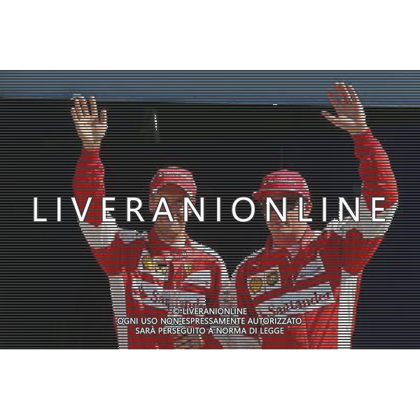 (L to R): Third placed Sebastian Vettel (GER) Ferrari and second placed team mate Kimi Raikkonen (FIN) Ferrari celebrate in parc ferme. 05.09.2015. Formula 1 World Championship, Rd 12, Italian Grand Prix, Monza, Italy, Qualifying Day. AG ALDO LIVERANI SAS ONLY ITALY