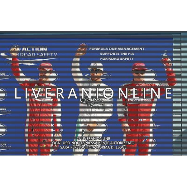 Qualifying top three in parc ferme (L to R): Sebastian Vettel (GER) Ferrari, third; Lewis Hamilton (GBR) Mercedes AMG F1, pole position; Kimi Raikkonen (FIN) Ferrari, second. 05.09.2015. Formula 1 World Championship, Rd 12, Italian Grand Prix, Monza, Italy, Qualifying Day. AG ALDO LIVERANI SAS ONLY ITALY