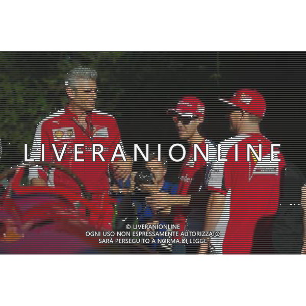 (L to R): Maurizio Arrivabene (ITA) Ferrari Team Principal; Sebastian Vettel (GER) Ferrari and team mate Kimi Raikkonen (FIN) Ferrari on the Monza banking at a Shell photoshoot. 05.09.2015. Formula 1 World Championship, Rd 12, Italian Grand Prix, Monza, Italy, Qualifying Day. AG ALDO LIVERANI SAS ONLY ITALY