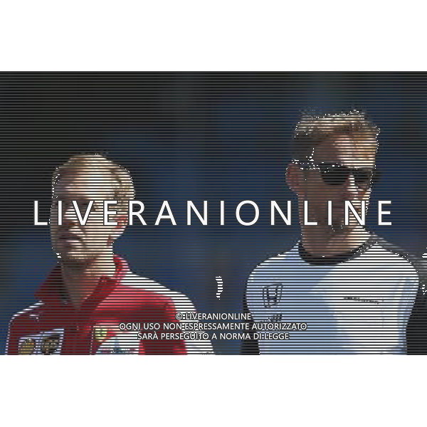 (L to R): Sebastian Vettel (GER) Ferrari and Jenson Button (GBR) McLaren on the drivers parade observe a minute\'s silence for Justin Wilson. 06.09.2015. Formula 1 World Championship, Rd 12, Italian Grand Prix, Monza, Italy, Race Day. AG ALDO LIVERANI SAS ONLY ITALY