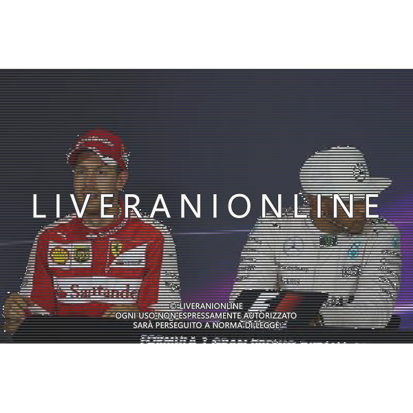 (L to R): Sebastian Vettel (GER) Ferrari and Lewis Hamilton (GBR) Mercedes AMG F1 in the FIA Press Conference. 06.09.2015. Formula 1 World Championship, Rd 12, Italian Grand Prix, Monza, Italy, Race Day. AG ALDO LIVERANI SAS ONLY ITALY