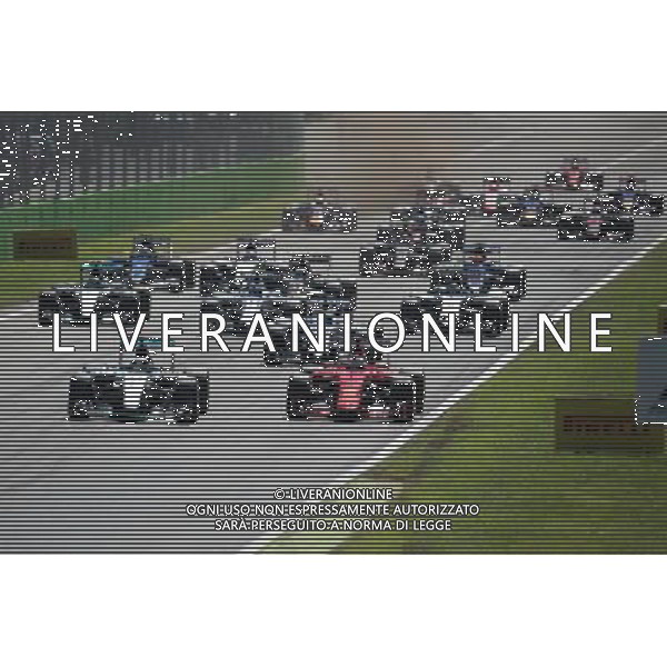 (L to R): Lewis Hamilton (GBR) Mercedes AMG F1 W06 and Sebastian Vettel (GER) Ferrari SF15-T at the start of the race. 06.09.2015. Formula 1 World Championship, Rd 12, Italian Grand Prix, Monza, Italy, Race Day. AG ALDO LIVERANI SAS ONLY ITALY
