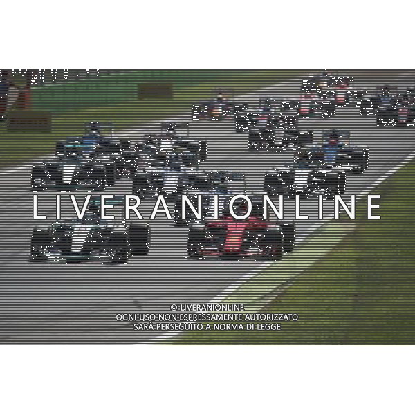 (L to R): Lewis Hamilton (GBR) Mercedes AMG F1 W06 and Sebastian Vettel (GER) Ferrari SF15-T at the start of the race. 06.09.2015. Formula 1 World Championship, Rd 12, Italian Grand Prix, Monza, Italy, Race Day. AG ALDO LIVERANI SAS ONLY ITALY