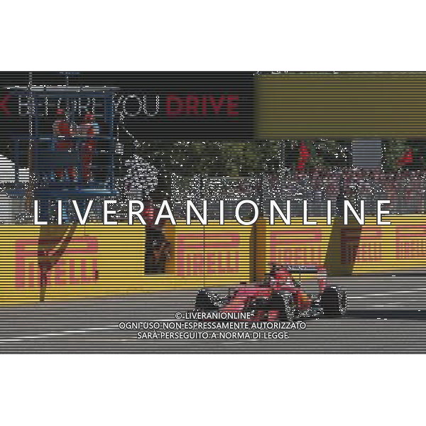 Second placed Sebastian Vettel (GER) Ferrari SF15-T celebrates as he takes the chequered flag at the end of the race. 06.09.2015. Formula 1 World Championship, Rd 12, Italian Grand Prix, Monza, Italy, Race Day. AG ALDO LIVERANI SAS ONLY ITALY