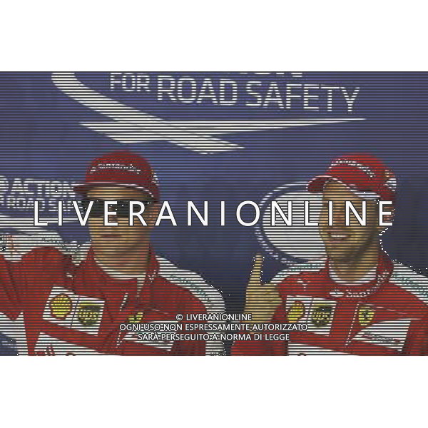 (L to R): Third placed Kimi Raikkonen (FIN) Ferrari in parc ferme with pole sitter Sebastian Vettel (GER) Ferrari. 19.09.2015. Formula 1 World Championship, Rd 13, Singapore Grand Prix, Singapore, Singapore, Qualifying Day. - www.xpbimages.com, EMail: requests@xpbimages.com - copy of publication required for printed pictures. Every used picture is fee-liable. Â© Copyright: Charniaux / XPB Images/Agenzia Aldo Liverani s.a.s.