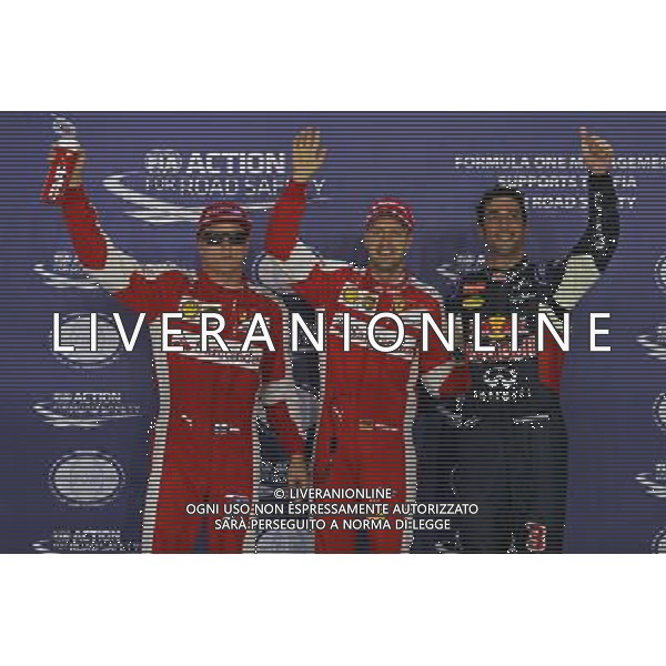 Qualifying top three in parc ferme (L to R): Kimi Raikkonen (FIN) Ferrari, third; Sebastian Vettel (GER) Ferrari, pole position; Daniel Ricciardo (AUS) Red Bull Racing, second. 19.09.2015. Formula 1 World Championship, Rd 13, Singapore Grand Prix, Singapore, Singapore, Qualifying Day. - www.xpbimages.com, EMail: requests@xpbimages.com - copy of publication required for printed pictures. Every used picture is fee-liable. Â© Copyright: Batchelor / XPB Images/Agenzia Aldo Liverani s.a.s.