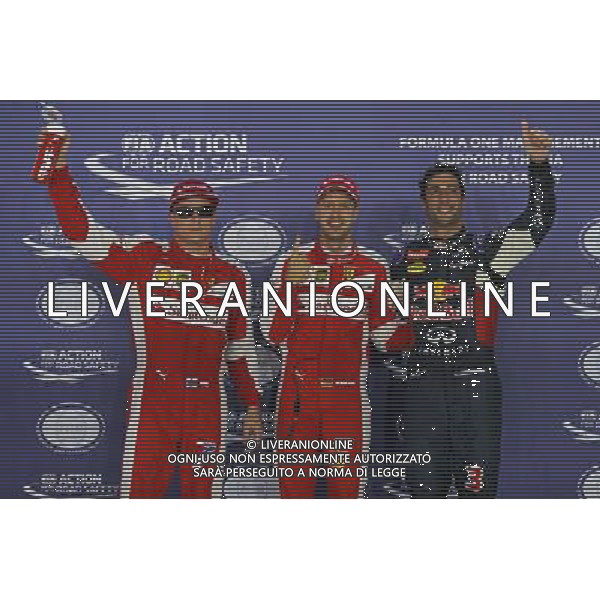 Qualifying top three in parc ferme (L to R): Kimi Raikkonen (FIN) Ferrari, third; Sebastian Vettel (GER) Ferrari, pole position; Daniel Ricciardo (AUS) Red Bull Racing, second. 19.09.2015. Formula 1 World Championship, Rd 13, Singapore Grand Prix, Singapore, Singapore, Qualifying Day. - www.xpbimages.com, EMail: requests@xpbimages.com - copy of publication required for printed pictures. Every used picture is fee-liable. Â© Copyright: Batchelor / XPB Images/Agenzia Aldo Liverani s.a.s.