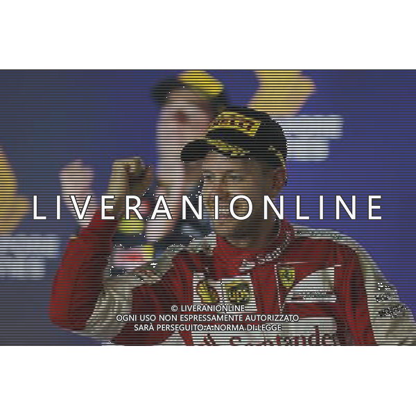 Race winner Sebastian Vettel (GER) Ferrari celebrates on the podium. 20.09.2015. Formula 1 World Championship, Rd 13, Singapore Grand Prix, Singapore, Singapore, Race Day. AG ALDO LIVERANI SAS ONLY ITALY