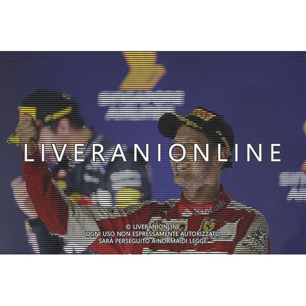Race winner Sebastian Vettel (GER) Ferrari celebrates on the podium. 20.09.2015. Formula 1 World Championship, Rd 13, Singapore Grand Prix, Singapore, Singapore, Race Day. AG ALDO LIVERANI SAS ONLY ITALY