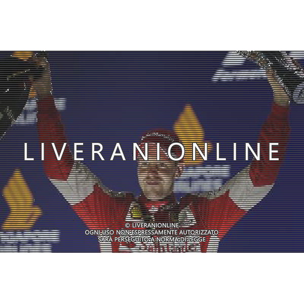 Race winner Sebastian Vettel (GER) Ferrari celebrates on the podium. 20.09.2015. Formula 1 World Championship, Rd 13, Singapore Grand Prix, Singapore, Singapore, Race Day. AG ALDO LIVERANI SAS ONLY ITALY