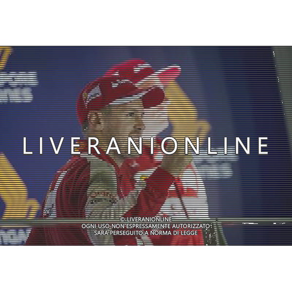 Race winner Sebastian Vettel (GER) Ferrari celebrates on the podium. 20.09.2015. Formula 1 World Championship, Rd 13, Singapore Grand Prix, Singapore, Singapore, Race Day. AG ALDO LIVERANI SAS ONLY ITALY