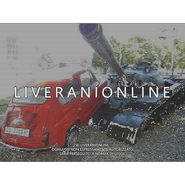 OSJEK CROAZIA 2015 NELLA FOTO Scritto sulla targa del monumento << Il 27 giugno, 1991 il carro armato del grande aggressore Serbo, distrusse la fiat rossa che fu parcheggiata in difesa di questo incrocio dal nostro cittadino Branko Breskic. In memoria della resistenza, della difesa e della vittoria sulla guerra imposta, questa installazione artistica  stata eretta dai cittadini della inconquistata cittˆ di Osijek. AG ALDO LIVERANI SAS