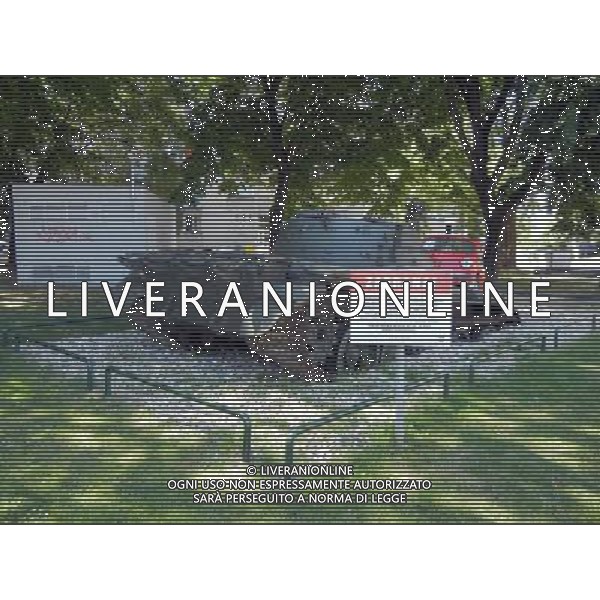 OSJEK CROAZIA 2015 NELLA FOTO Scritto sulla targa del monumento << Il 27 giugno, 1991 il carro armato del grande aggressore Serbo, distrusse la fiat rossa che fu parcheggiata in difesa di questo incrocio dal nostro cittadino Branko Breskic. In memoria della resistenza, della difesa e della vittoria sulla guerra imposta, questa installazione artistica  stata eretta dai cittadini della inconquistata cittˆ di Osijek. AG ALDO LIVERANI SAS