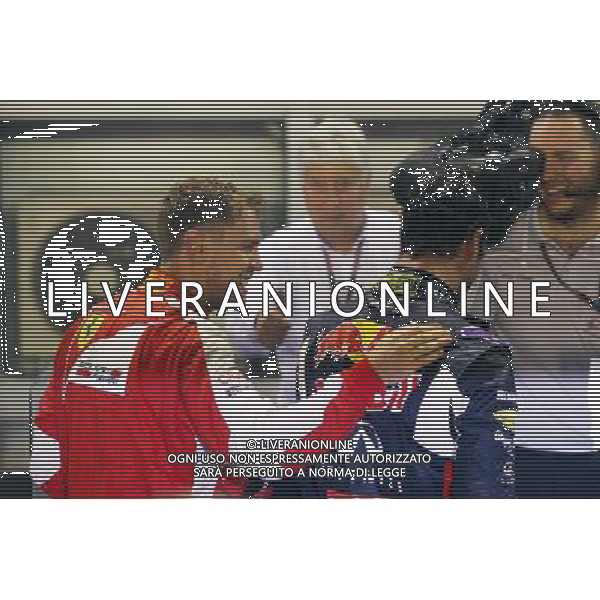 (L to R): Race winner Sebastian Vettel (GER) Ferrari celebrates in parc ferme with second placed Daniel Ricciardo (AUS) Red Bull Racing. 20.09.2015. Formula 1 World Championship, Rd 13, Singapore Grand Prix, Singapore, Singapore, Race Day. AG ALDO LIVERANI SAS ONLY ITALY