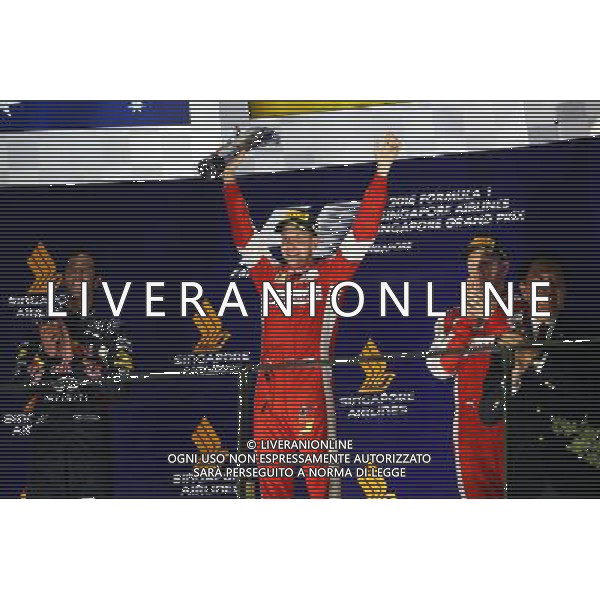 Race winner Sebastian Vettel (GER) Ferrari celebrates on the podium. 20.09.2015. Formula 1 World Championship, Rd 13, Singapore Grand Prix, Singapore, Singapore, Race Day. AG ALDO LIVERANI SAS ONLY ITALY