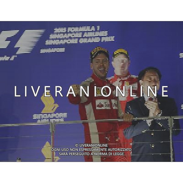 Race winner Sebastian Vettel (GER) Ferrari celebrates on the podium. 20.09.2015. Formula 1 World Championship, Rd 13, Singapore Grand Prix, Singapore, Singapore, Race Day. AG ALDO LIVERANI SAS ONLY ITALY