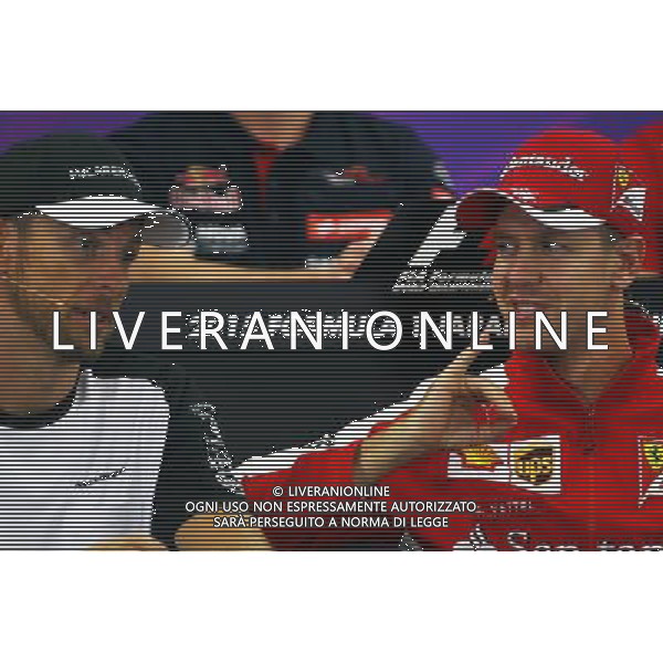 (L to R): Jenson Button (GBR) McLaren with Sebastian Vettel (GER) Ferrari in the FIA Press Conference. 24.09.2015. Formula 1 World Championship, Rd 14, Japanese Grand Prix, Suzuka, Japan, Preparation Day. AG ALDO LIVERANI SAS ONLY ITALY
