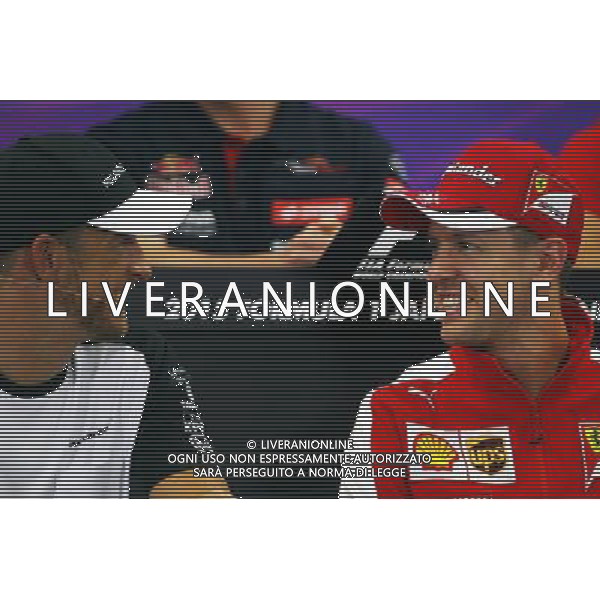 (L to R): Jenson Button (GBR) McLaren with Sebastian Vettel (GER) Ferrari in the FIA Press Conference. 24.09.2015. Formula 1 World Championship, Rd 14, Japanese Grand Prix, Suzuka, Japan, Preparation Day. AG ALDO LIVERANI SAS ONLY ITALY