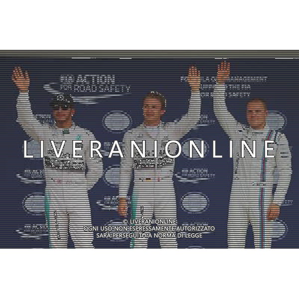 Qualifying top three in parc ferme (L to R): Lewis Hamilton (GBR) Mercedes AMG F1, second; Nico Rosberg (GER) Mercedes AMG F1, pole position; Valtteri Bottas (FIN) Williams, third. 26.09.2015. Formula 1 World Championship, Rd 14, Japanese Grand Prix, Suzuka, Japan, Qualifying Day. AG ALDO LIVERANI SAS ONLY ITALY