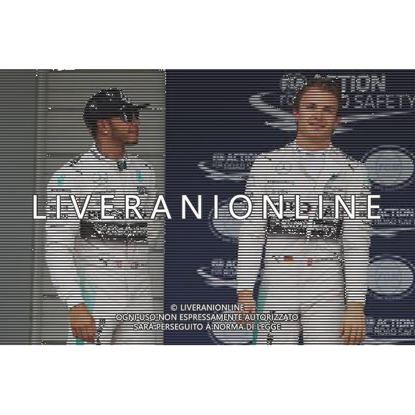 (L to R): Lewis Hamilton (GBR) Mercedes AMG F1 with team mate Nico Rosberg (GER) Mercedes AMG F1 in parc ferme. 26.09.2015. Formula 1 World Championship, Rd 14, Japanese Grand Prix, Suzuka, Japan, Qualifying Day. AG ALDO LIVERANI SAS ONLY ITALY