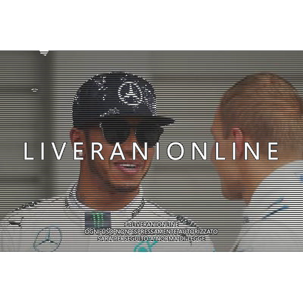 (L to R): Lewis Hamilton (GBR) Mercedes AMG F1 with Valtteri Bottas (FIN) Williams in parc ferme. 26.09.2015. Formula 1 World Championship, Rd 14, Japanese Grand Prix, Suzuka, Japan, Qualifying Day. AG ALDO LIVERANI SAS ONLY ITALY