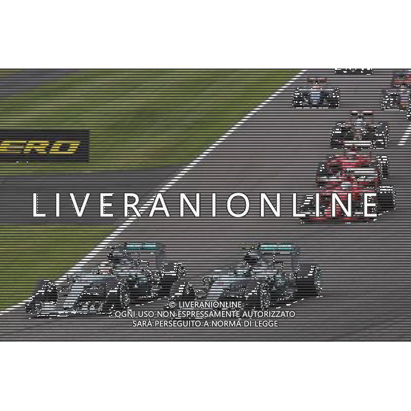 (L to R): Lewis Hamilton (GBR) Mercedes AMG F1 W06 and Nico Rosberg (GER) Mercedes AMG F1 W06 lead at the start of the race. 27.09.2015. Formula 1 World Championship, Rd 14, Japanese Grand Prix, Suzuka, Japan, Race Day. AG ALDO LIVERANI SAS ONLY ITALY