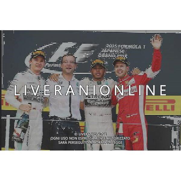 The podium (L to R): Nico Rosberg (GER) Mercedes AMG F1, second; Lewis Hamilton (GBR) Mercedes AMG F1, race winner; Sebastian Vettel (GER) Ferrari, race winner. 27.09.2015. Formula 1 World Championship, Rd 14, Japanese Grand Prix, Suzuka, Japan, Race Day. AG ALDO LIVERANI SAS ONLY ITALY