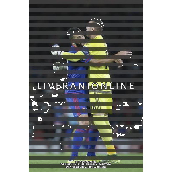 Olympiakos\' Dimitris Siovas celebrates his sides third goal with Roberto (right) Photographer Craig Mercer/CameraSport Football - UEFA Champions League Group F - Arsenal v Olympiakos - Tuesday 29th September 2015 - Emirates Stadium - London - © CameraSport - 43 Linden Ave. Countesthorpe. Leicester. England. LE8 5PG - Tel: +44 (0) 116 277 4147 - admin@camerasport.com - www.camerasport.com AG ALDO LIVERANI SAS ONLY ITALY