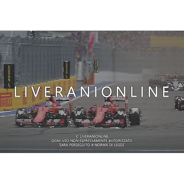 (L to R): Sebastian Vettel (GER) Ferrari SF15-T and team mate Kimi Raikkonen (FIN) Ferrari SF15-T battle for position. 11.10.2015. Formula 1 World Championship, Rd 15, Russian Grand Prix, Sochi Autodrom, Sochi, Russia, Race Day. - www.xpbimages.com, EMail: requests@xpbimages.com - copy of publication required for printed pictures. Every used picture is fee-liable. © Copyright: Charniaux / XPB Images /Agenzia Aldo Liverani s.a.s.