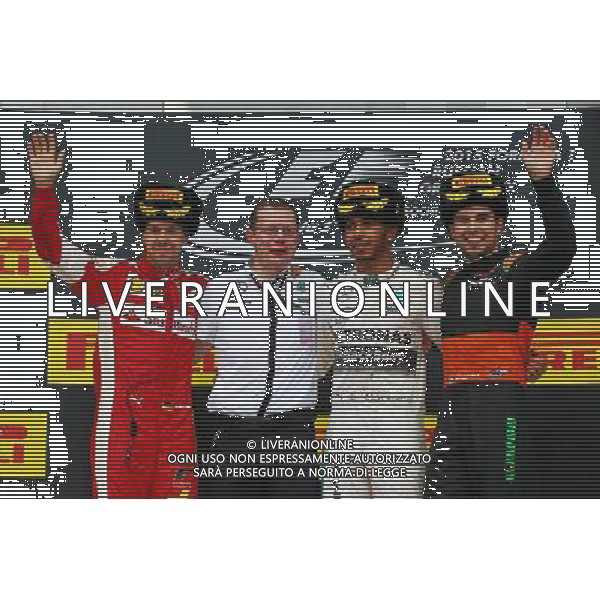 The podium (L to R): Sebastian Vettel (GER) Ferrari, second; Lewis Hamilton (GBR) Mercedes AMG F1, race winner; Sergio Perez (MEX) Sahara Force India F1, third. 11.10.2015. Formula 1 World Championship, Rd 15, Russian Grand Prix, Sochi Autodrom, Sochi, Russia, Race Day. - www.xpbimages.com, EMail: requests@xpbimages.com - copy of publication required for printed pictures. Every used picture is fee-liable. © Copyright: Batchelor / XPB Images /Agenzia Aldo Liverani s.a.s.